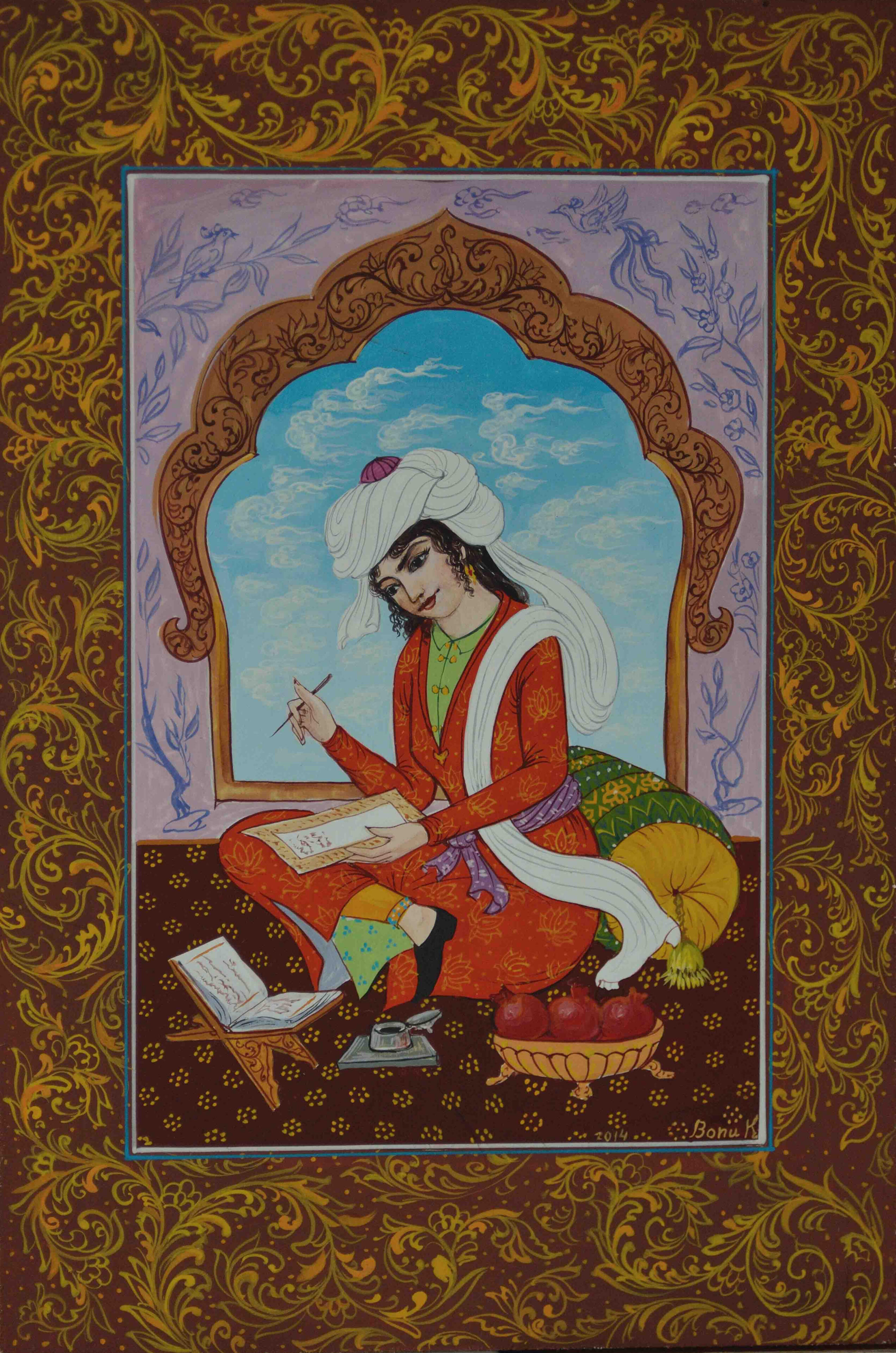 Photo of Olim Kamolzoda sitting at the desk in his workshop. He is the Honoured Artist of the Republic of Tajikistan, a Member of the Union of Artists of the Republic of Tajikistan, and a Specialist of the Miniature Art. Studying the specifics of the work