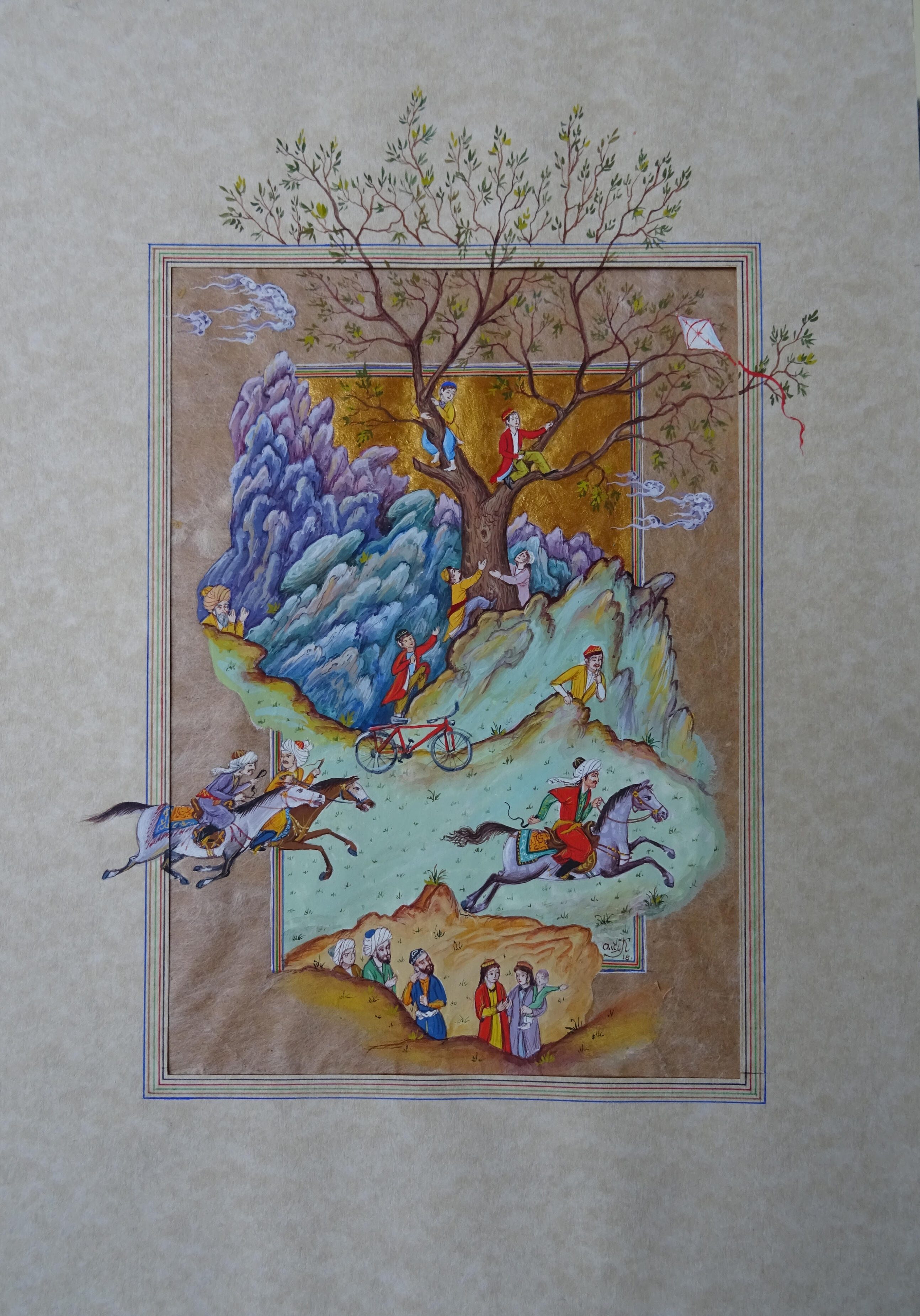 Photo of Olim Kamolzoda sitting at the desk in his workshop. He is the Honoured Artist of the Republic of Tajikistan, a Member of the Union of Artists of the Republic of Tajikistan, and a Specialist of the Miniature Art. Studying the specifics of the work