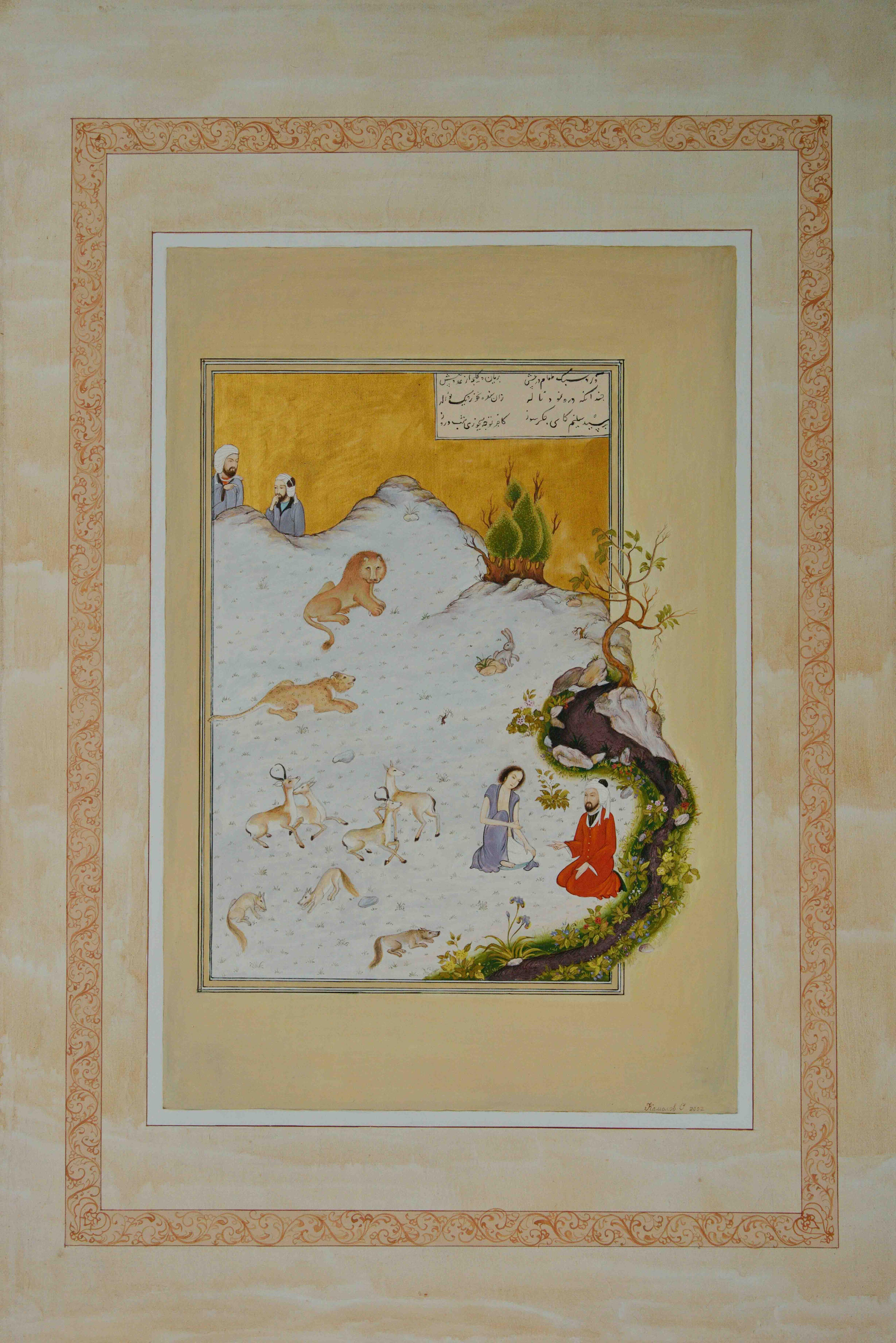 Photo of Olim Kamolzoda sitting at the desk in his workshop. He is the Honoured Artist of the Republic of Tajikistan, a Member of the Union of Artists of the Republic of Tajikistan, and a Specialist of the Miniature Art. Studying the specifics of the work